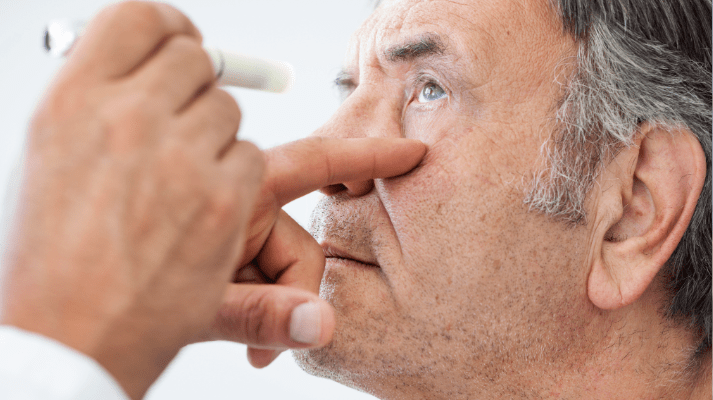 eye doctor examining patient for cataracts